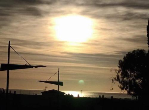 a sunset over the ocean with the sun in the sky at Palomares in Cuevas del Almanzora
