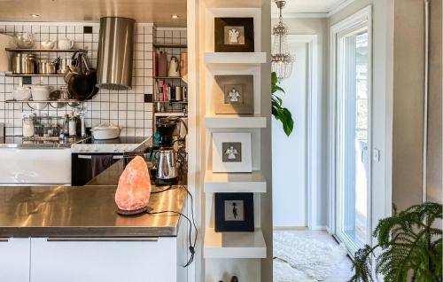 a kitchen with a counter and a stove top oven at Sandviken in Sölvesborg