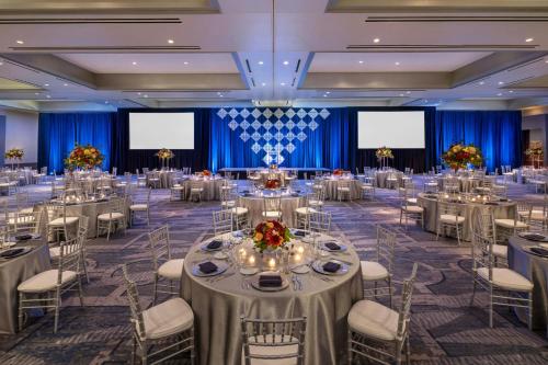 a banquet hall with tables and chairs in a room at Renaissance Boston Seaport District in Boston