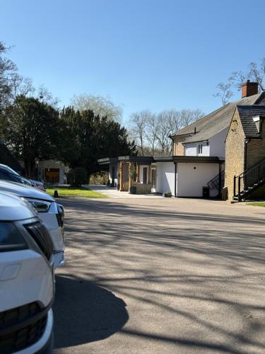 a car parked in front of a house at The Mill Sharnbrook in Sharnbrook