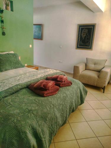 a bedroom with a bed with two pillows on it at Home4U apt1, just 8Km from airport in Markopoulo