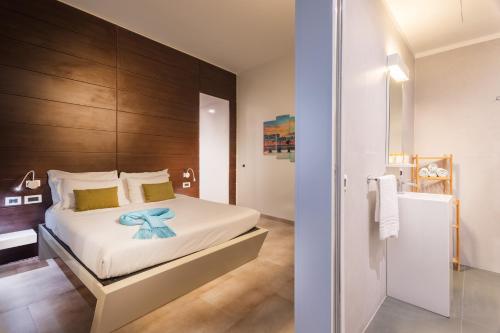a bedroom with a bed with a blue flower on it at Navona Stay in Rome