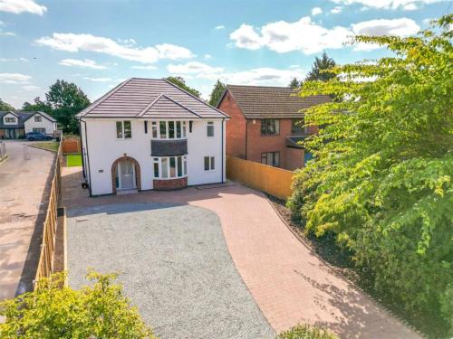 an aerial view of a house with a driveway at Beautiful, luxury house! in Higham on the Hill