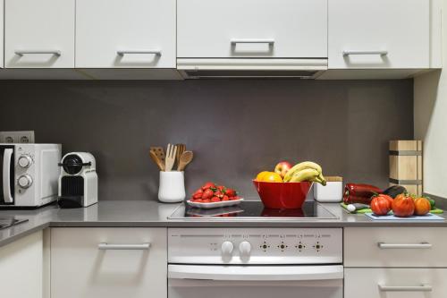 Kuchyň nebo kuchyňský kout v ubytování Apartamentos Cornellalux