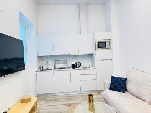 Η κουζίνα ή μικρή κουζίνα στο QE Apartments