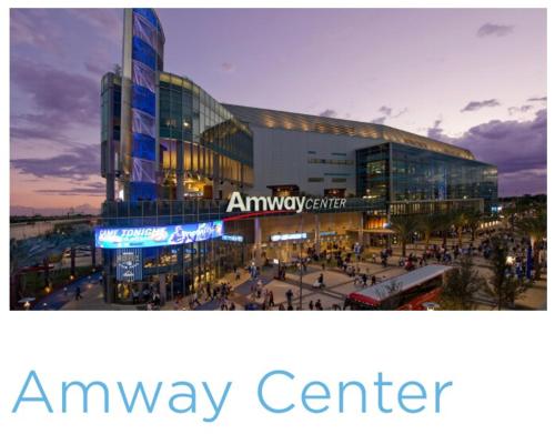 an amway center with people walking in front of a building at College Park-Orlando 5Star Villa Oasis - Home Away From Home - QUIET Neighborhood-PRIVATE Botanical Courtyard - mins from EOLA,DT, Winter Park - Free Parking & EV Plug In in Orlando