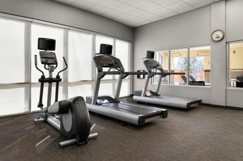 a gym with three cardio machines in a room at Courtyard by Marriott Fayetteville Fort Liberty - Spring Lake in Spring Lake