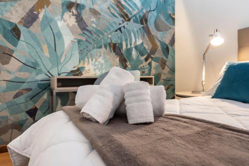 Ένα ή περισσότερα κρεβάτια σε δωμάτιο στο Suite Deluxe in Palazzo Storico - Centro Sassari - Appartamento Ajaccio
