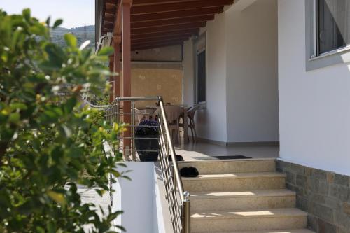 a cat laying on the stairs of a house at Lana's House in Berat