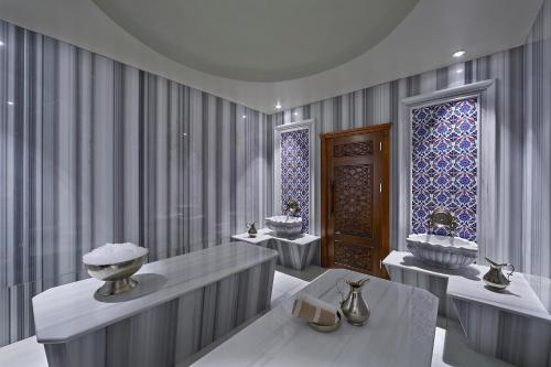 a bathroom with two sinks and a window at Uranus Istanbul Topkapi in Istanbul