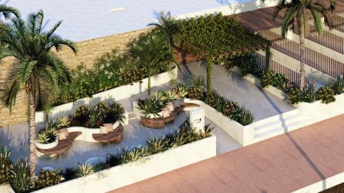 an overhead view of a garden with palm trees at Hotel Indigo Gandia Beach by IHG in Gandía