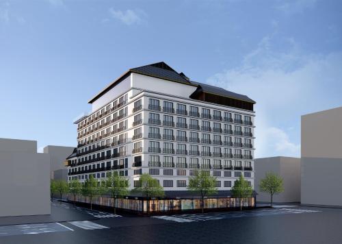 a rendering of a large white building at voco Xishuangbanna Gaozhuang by IHG in Jinghong