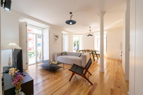 a living room with a couch and a table at Sunny Lisbon Apartments by Soulplaces in Lisbon