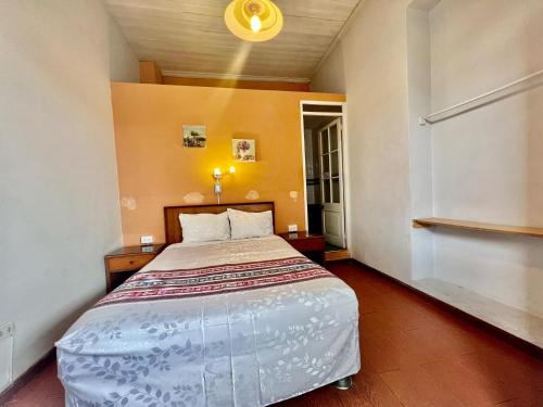 a bedroom with a large bed in a room at Casona Jerusalen in Arequipa