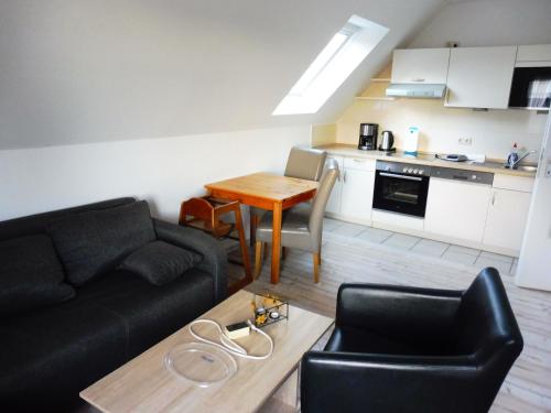 Η κουζίνα ή μικρή κουζίνα στο Apartments Bensersiel