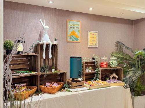 a table with baskets of flowers and other items at Finders Hotel Hualien Wen Hua in Hualien City