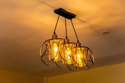 a chandelier hanging from the ceiling in a room at Timeless Escape in Arusha
