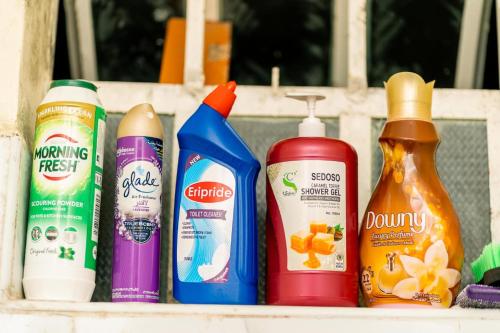 a shelf filled with different types of cleaning products at Lelesta in Bomet
