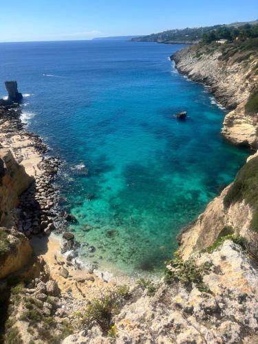 an aerial view of the ocean on a rocky coast at Villa Eos con Piscina Privata nel cuore del Parco Naturale di Andrano in Andrano