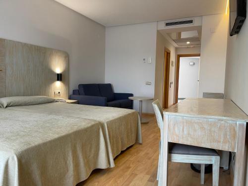Una cama o camas en una habitación de AGH Canet