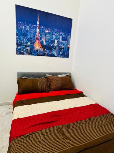 a bedroom with a bed with a picture of the eiffel tower at The Pine Lodge- Bukit Tinggi Klang in Klang