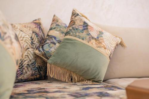 a group of pillows sitting on a couch at FAMiLY HOME in Agadir