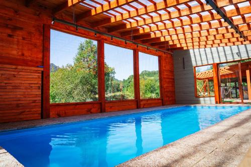 Бассейн в Cabaña 4 personas hualle sur cerca huilo huilo или поблизости