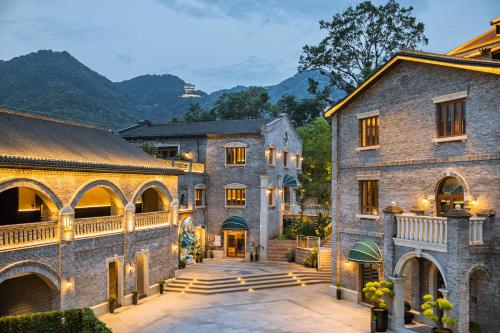 an exterior view of a large stone building at CHONGQING MANQUE MANSION in Chongqing