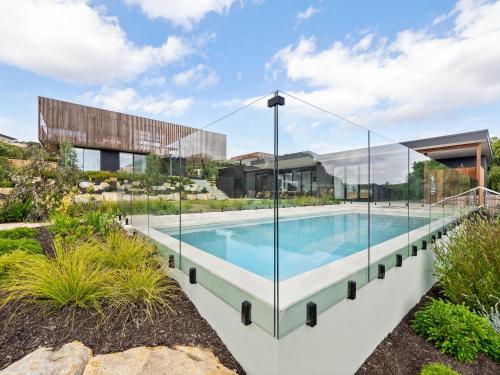 an image of a swimming pool with glass walls at Lumiere-Stunning Coastal Retreat in Gnarabup