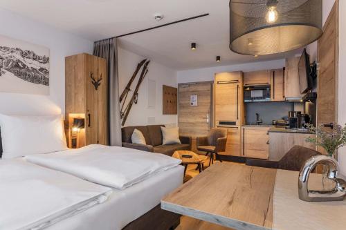 Katil atau katil-katil dalam bilik di AlpenParks Hotel & Apartment Taxacher