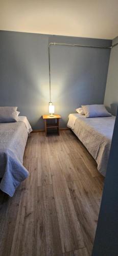 Postel nebo postele na pokoji v ubytování Cabañas M&R
