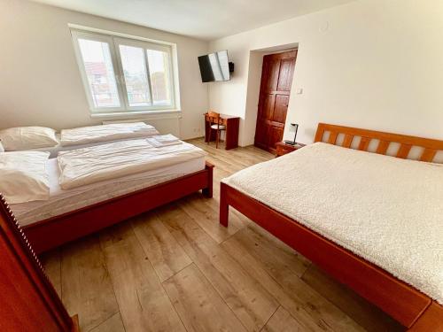 Postel nebo postele na pokoji v ubytování Vila u Urbana