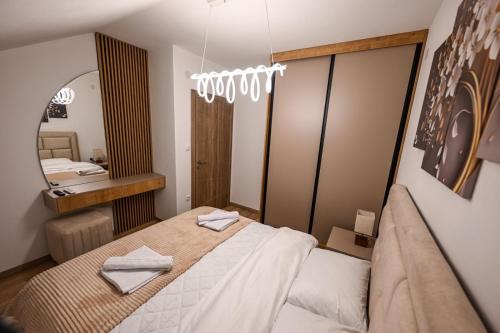 Postel nebo postele na pokoji v ubytování Apartmani EMA SL