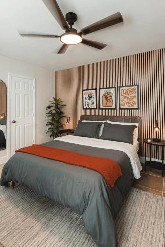 a bedroom with a large bed with a ceiling fan at Cozy Miami Suite with FREE Parking in Miami