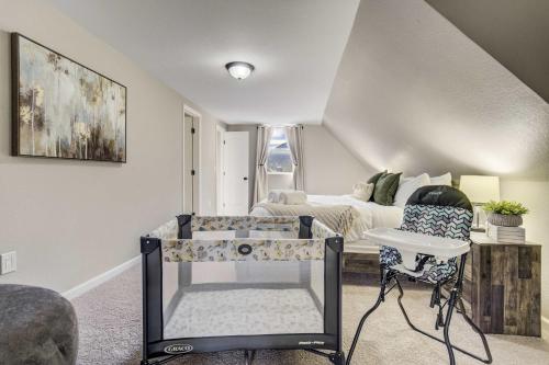 a bedroom with a bed and a table and chairs at Mountain Villa Scenic Views Hot Tub & Fire Pit in Cascade-Chipita Park