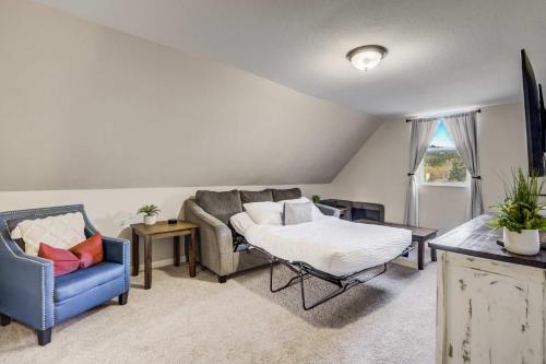 a living room with a couch and a chair at Mountain Villa Scenic Views Hot Tub & Fire Pit in Cascade-Chipita Park