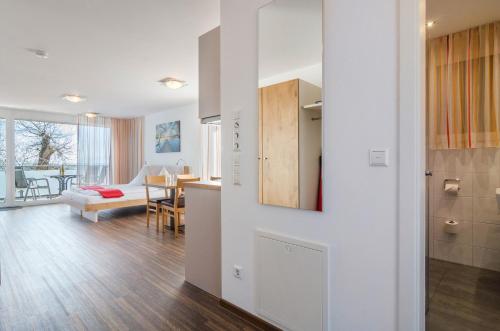 a room with a kitchen and a living room at Gästehaus D i c k r e i t e r in Immenstaad am Bodensee