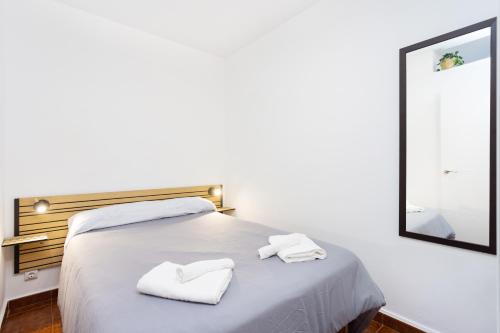 En eller flere senge i et værelse på El mirador de Angeles