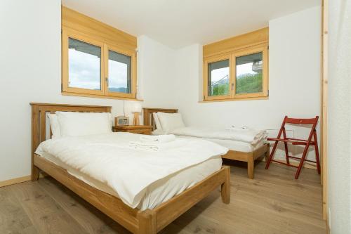 Postel nebo postele na pokoji v ubytování Chalet Anna