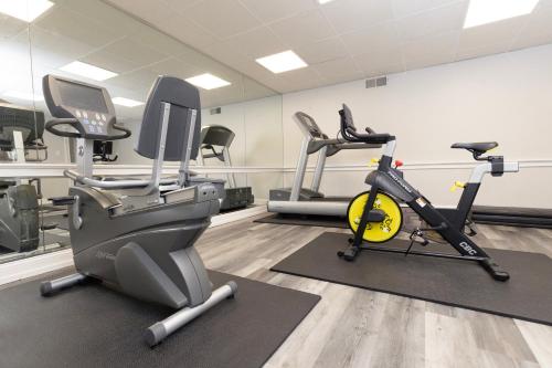 a gym with two treadmills and two exercise bikes at Brandywine River Hotel in Chadds Ford