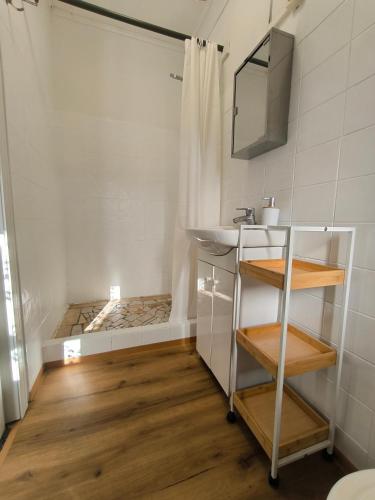 a bathroom with a sink and a mirror at Dorci Vendégház - A piece of peace in Cserépfalu