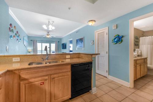 a kitchen with a sink and a dishwasher at Crystal Tower 1906 by Vacation Homes Collection in Gulf Shores