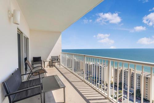 a balcony with chairs and a view of the ocean at Crystal Tower 1906 by Vacation Homes Collection in Gulf Shores