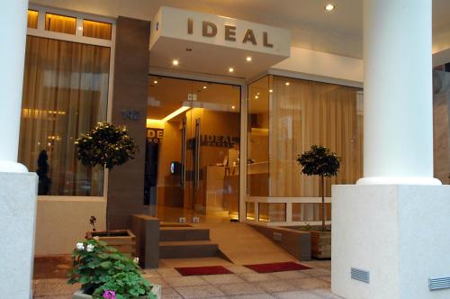a store front of a building with a sign on it at Hotel Ideal in Piraeus