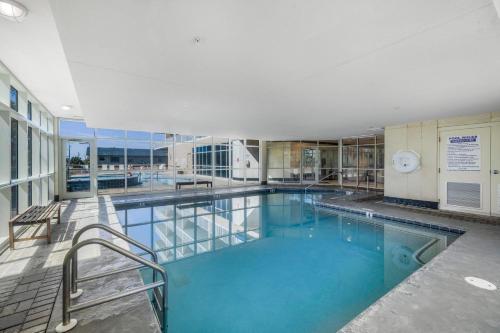 a large swimming pool in a building at Crystal Tower 1906 by Vacation Homes Collection in Gulf Shores