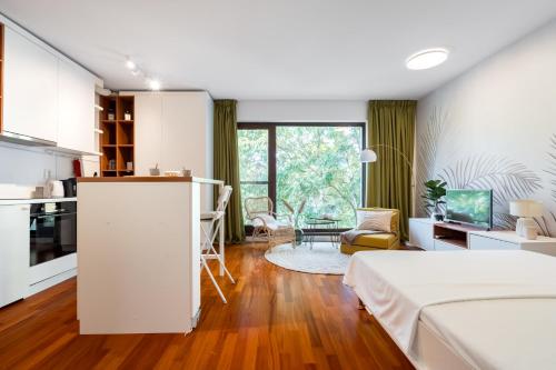 En eller flere senge i et værelse på Urban Jungle