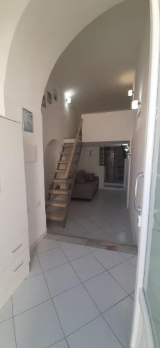 an empty hallway with a staircase in a building at Casa Vacanze Salvo in Ischia