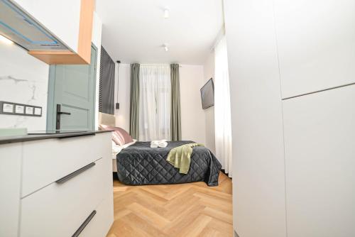 a bedroom with a bed in a room at Homly Nook in Rīga