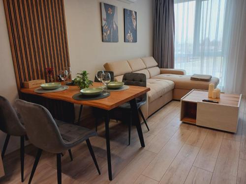 a living room with a table and a couch at Your Home in Plovdiv with Free Private Parking in Plovdiv