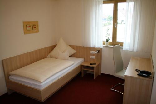 מיטה או מיטות בחדר ב-Landhotel Winter